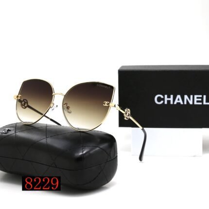 Chanel gold rimmed and black gradient droplet shaped sunglasses