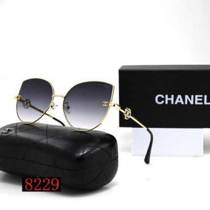 Chanel gold rimmed and deep blue gradient water droplet shaped sunglasses