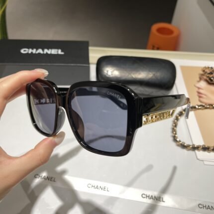 Chanel black and deep blue gold hollowed out logo sunglasses