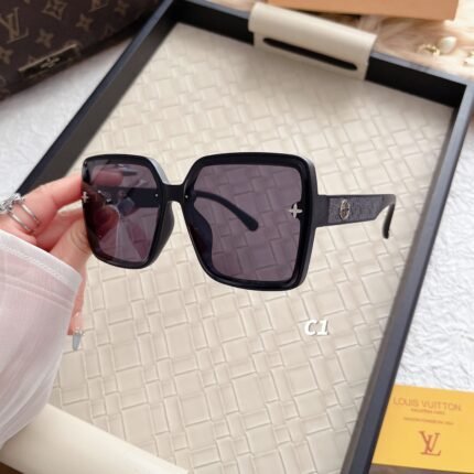Louis Vuitton sunglasses with black bezels and deep purple lenses