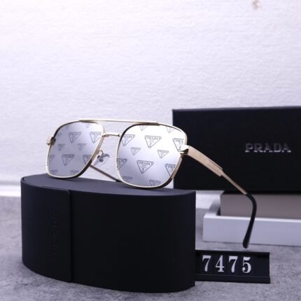 PRADA   Luxury sunglasses with gold border and gray printed lenses