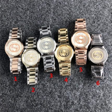 Gucci watch circular minimalist dial steel strip