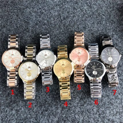 Gucci watch circular minimalist dial steel strip