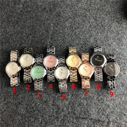 Gucci watch circular minimalist dial steel strip