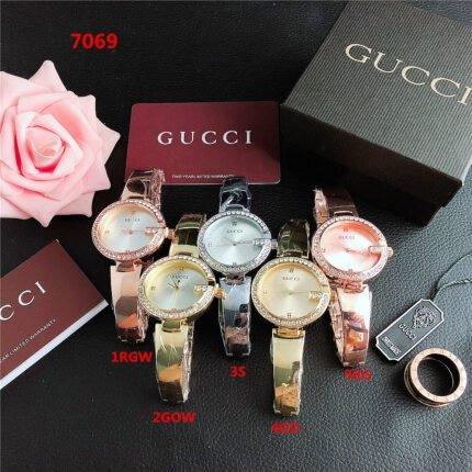 Gucci watch with round diamond bezel and minimalist dial steel strip