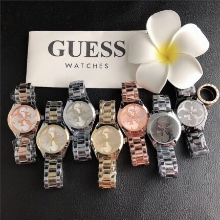 GUESS watch circular minimalist dial steel strap