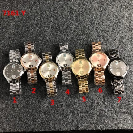 TOUS watch circular peach silk pattern minimalist dial metal steel strip