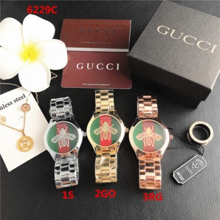 Gucci watch circular minimalist dial steel strip