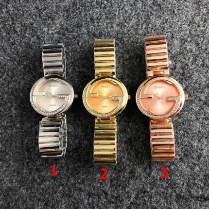 Gucci watch circular minimalist dial steel strip
