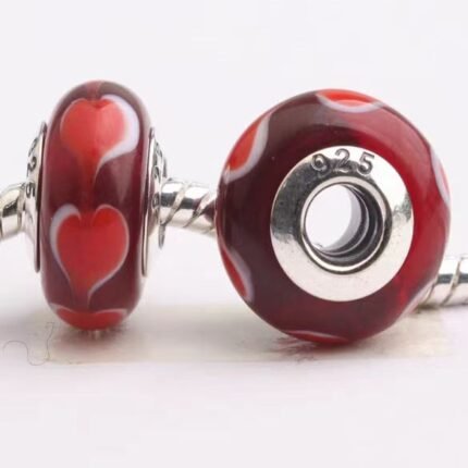 Pandora's white-edged heart-shaped red glass beads are delicate and simple