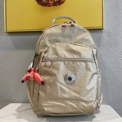 KIPLING simple and stylish beige backpack, equipped with cute cartoon dolls