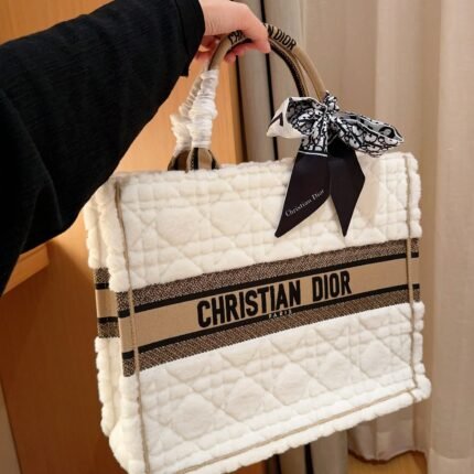 A white tote bag with lamb fur and rattan grid, which I have come to know