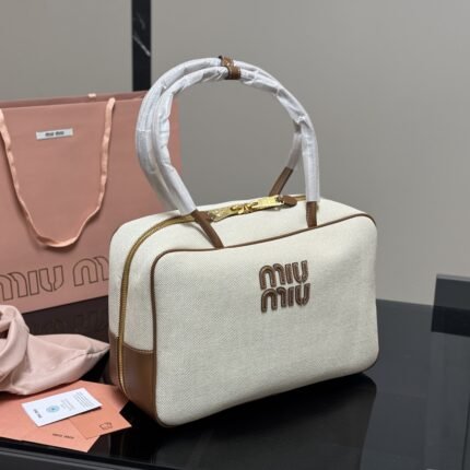 The new bowling ball-shaped canvas briefcase can be carried by hand or across the body