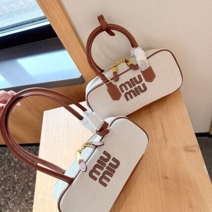 Bowling ball shaped briefcase made of calfskin and canvas is suitable for daily parties