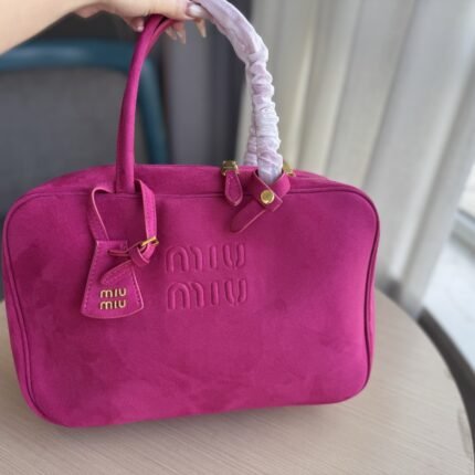 Bowling balls and briefcases can be carried by hand or slung across the shoulder, featuring vibrant colors