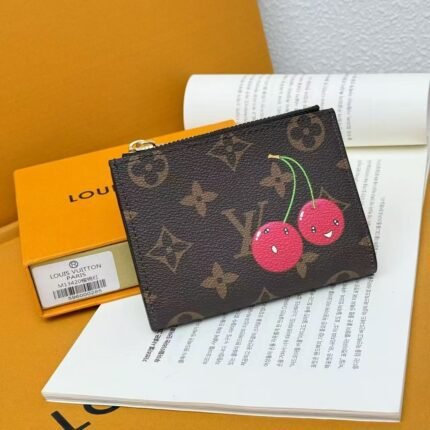 The LV Cherry Compact Wallet features a corner brace coin pocket and a LV circle on the handle