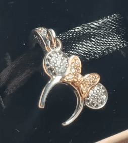 Pandora Minnie Mouse Bow Pendant: Sparkling Two - Tone Charm with Disney Magic