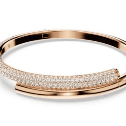 This Swarovski Dextera bracelet features a rose-gold tone plating, with one half adorned with pavé-set clear crystals.
